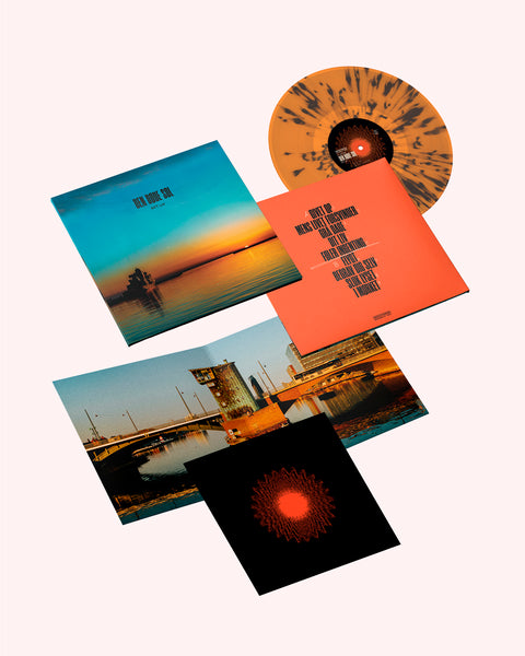 NYT LIV - Den døde sol (Transparent Orange & Black Splatter)